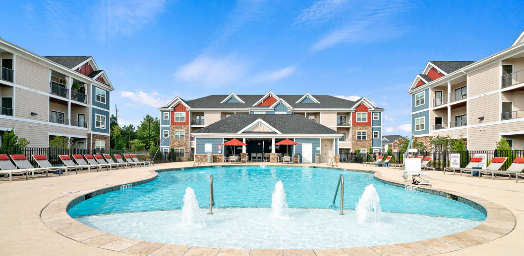 Hawthorne at Weaverville luxury outdoor pool with lounge chairs and surrounding seating