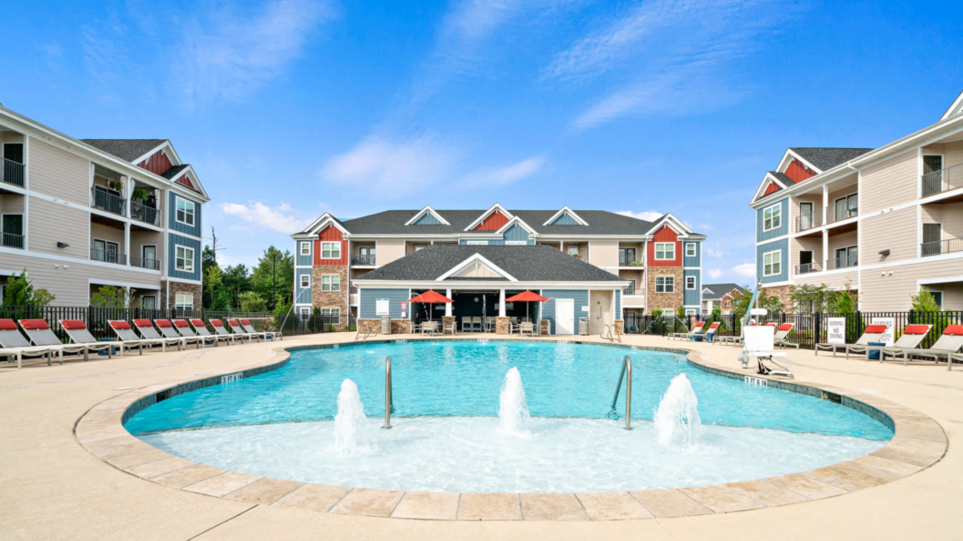 Hawthorne at Weaverville apartments community exterior with large green lawn and large dog park