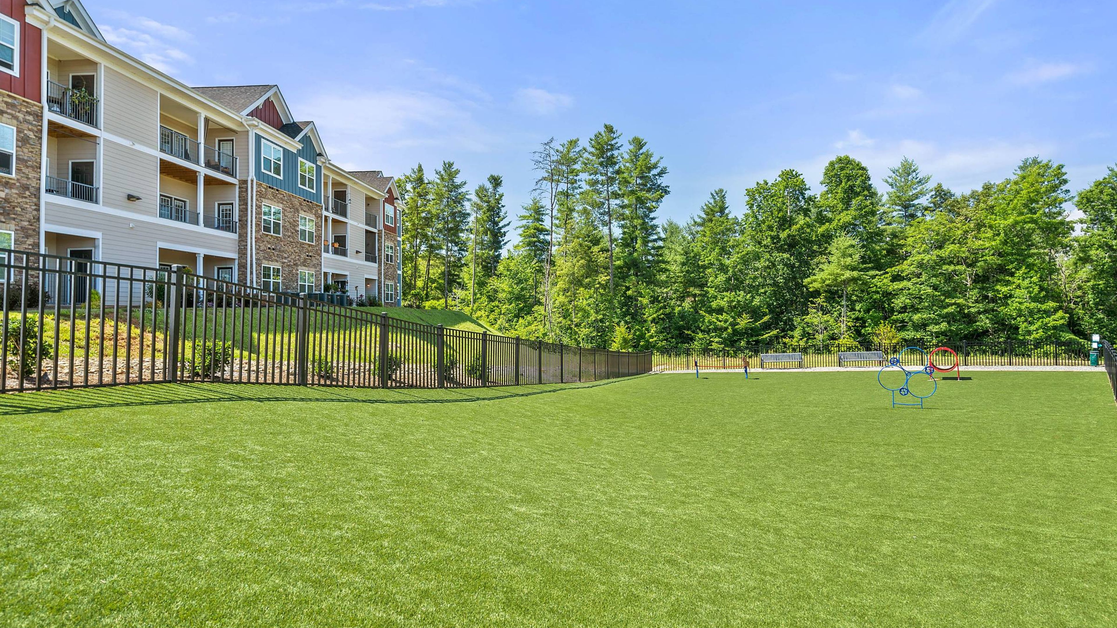 Hawthorne at Weaverville apartments community exterior with large green lawn and large dog park